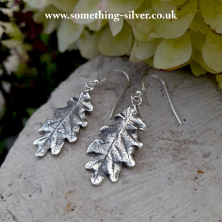 Sterling Silver oak leaf drop earrings with natural background