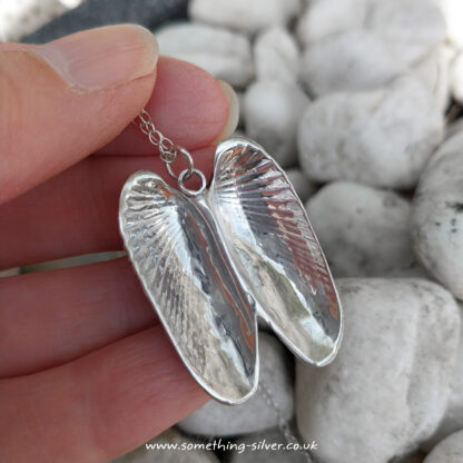 Double-Angel-Wing-Pendant-in-hand2